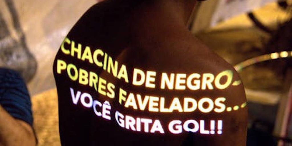 "Massacre of black, poor favela residents and you shout goal!"
