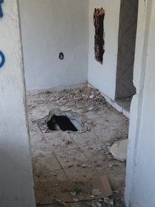 metro2 House with holes on the floor and the walls, damaged by City workers