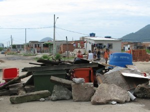 A barricade blocking the way into the community