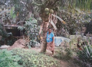 Dona Rita in her organic fruit & veg garden