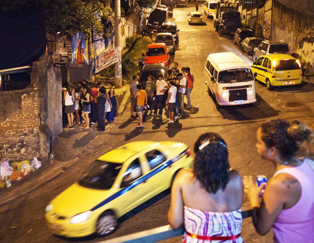 Controlled territory. Favela residents in Vidigal watch at the entrance to the Lamparina party. The ‘playboy’ parties continue to disturb the sounds of the community, with baile funks now practically forbidden.