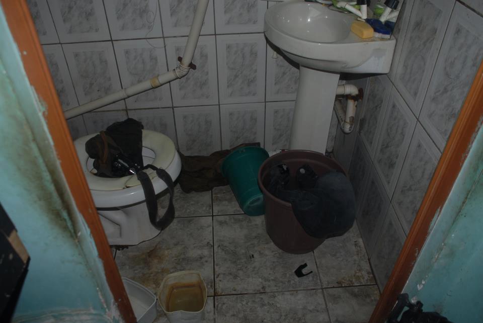 Bira's work equipment, a photographic camera, was found inside the toilet. 