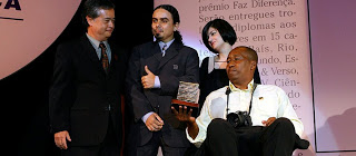 Bira, holding the Make the Difference Award