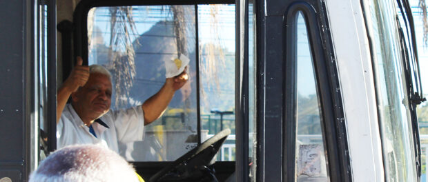 A bus driver shows his support despite being delayed by the demonstration.