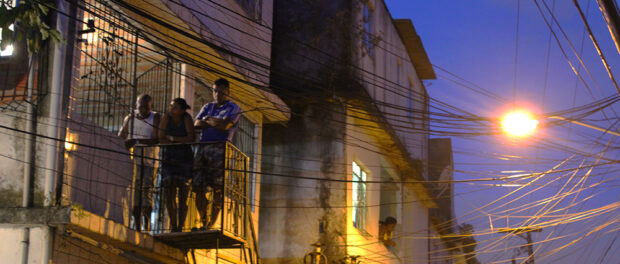 Residents watch the crowd below