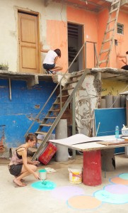 Activists renovate a space Saturday at the ReintegraAÇÃO event in Complexo do Alemão.