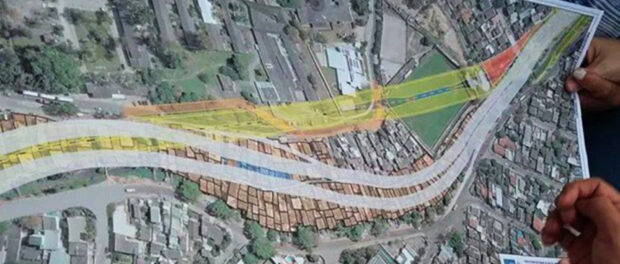 Original route in gray, revised route announced in December in yellow, traversing largely empty areas: a hospital courtyard, pre-existing street and a privately-owned soccer field.