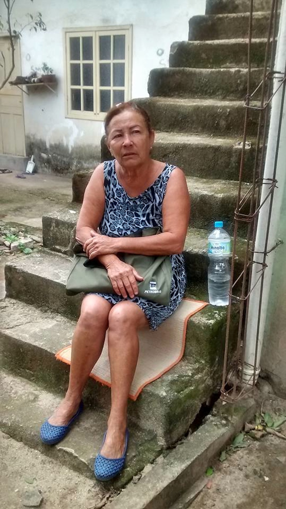 Mariza do Amor Divino returns from a doctor's appointment to find her home demolished. Photo from Vila Autódromo community Facebook page on.fb.me/1W9NoAE