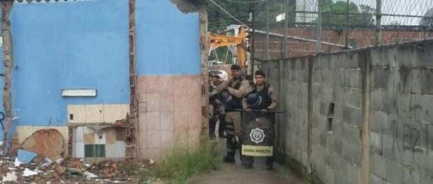 Guards blocking access to demolition