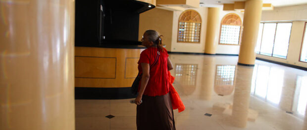 Resident entering the occupation through the former hotel lobby