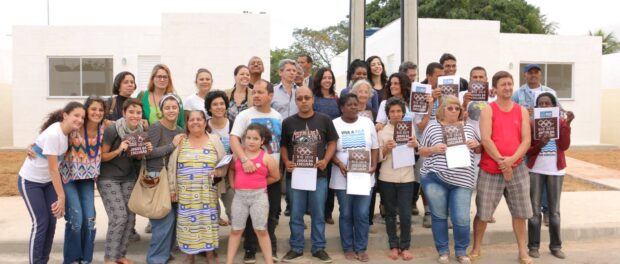 Residents in front of new homes