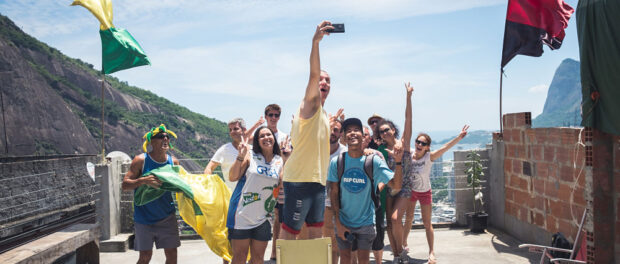 Tour group takes a selfie at Portal Joana Brasil. Photo by Rocinha By Rocinha tours aim to give visitors an immersive community experience. Photo by Erik leads a tour through Rocinha. Photo by Darko Boskovic