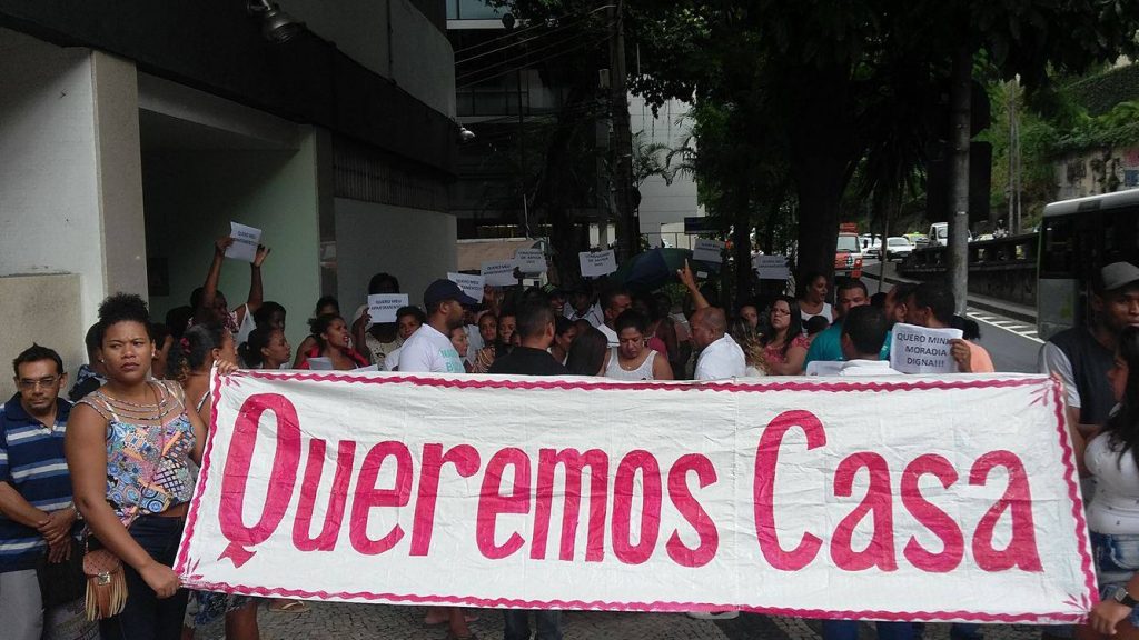 "We Want a House" Residents march by the Guanbara Palace