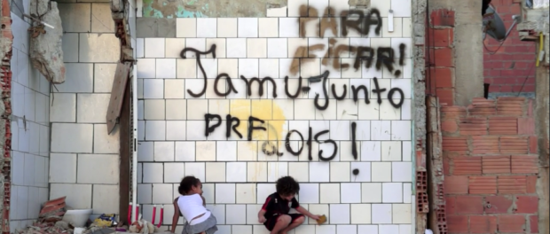 Children play in a half-demolished house in Vila Autódromo, 1 year before the 2016 Olympic Games.