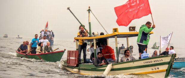 Fishermen and community members protest the pollution of Guanabara bay by oil spills and sewage leaks.