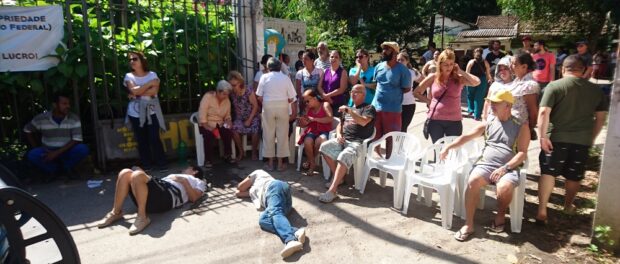 Residents guarding the entrance to the community