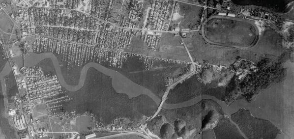 An aerial view of the Martín Peña Canal in the 1930s, showing the extent of mangrove swamps that once lined the canal.