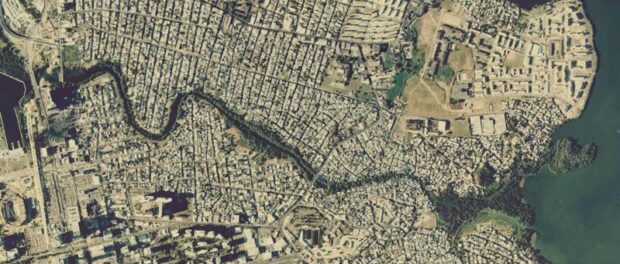 An aerial view of the Martín Peña Canal in the 2000s, showing that almost all mangrove swamps have been filled, and the canal is significantly narrower. An aerial view of the Martín Peña Canal in the 2000s, showing that almost all mangrove swamps have been filled, and the canal is significantly narrower.