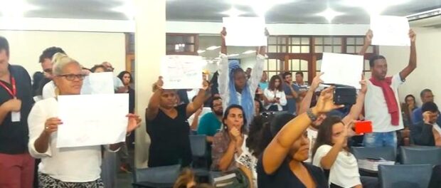 Residents hold banners calling for an end to violence.