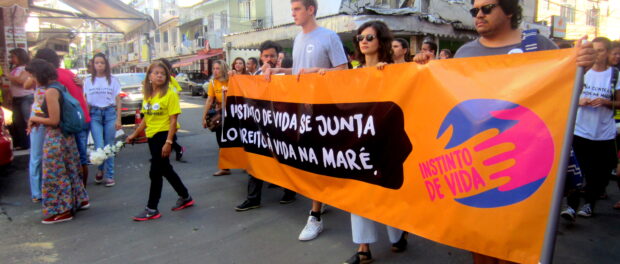 Protesters hold sign from the event. 