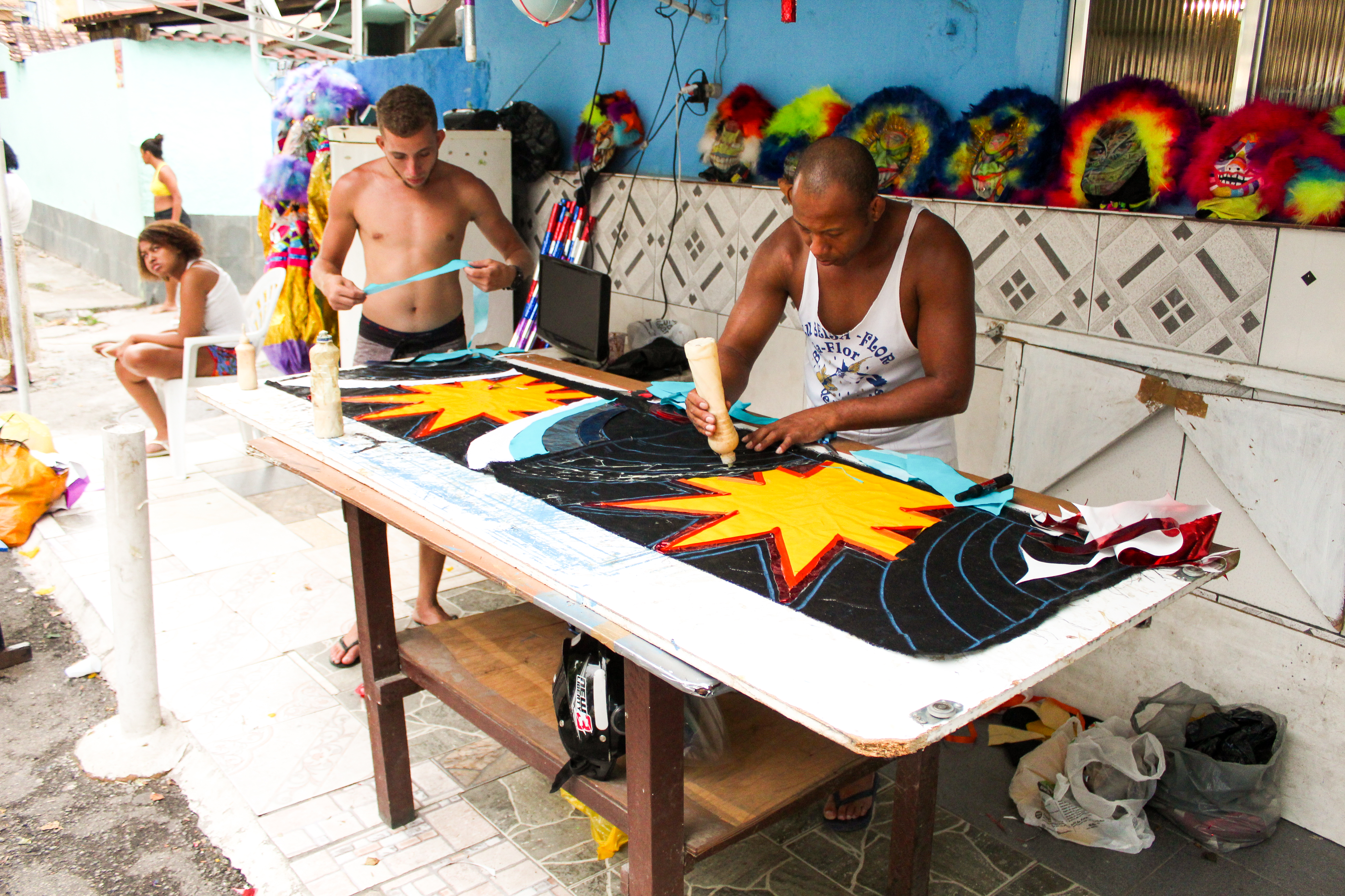 Anderson Luiz, known as "Playboy," working on costumes. Photo: Jota Marques